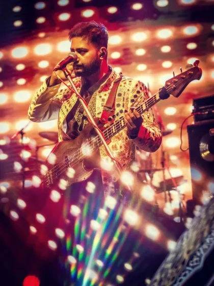 Our bassist, lit by a prism of light, during a dynamic performance.