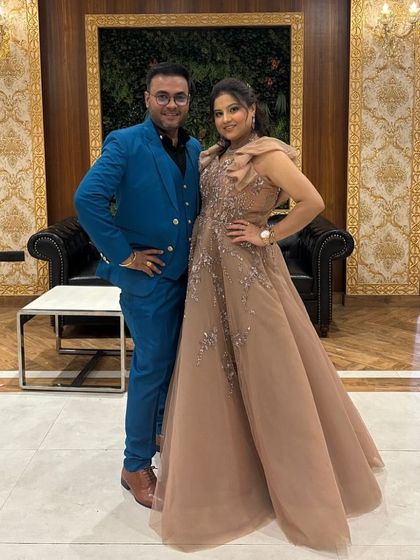 A happy client looking elegant in a dusty pink off-shoulder gown. This is a perfect choice for a cocktail party or reception, offering a blend of glamour and sophistication.
