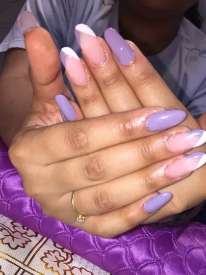 Another angle of the lilac V-French gel extensions, showing how the sharp lines elongate the fingers and create a very chic look.