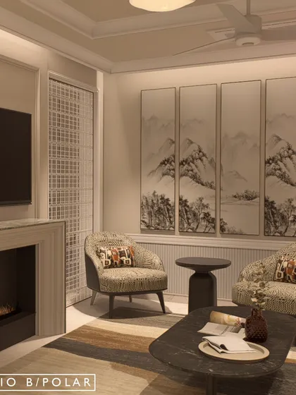 Another seating area in the villa, featuring a marble-clad fireplace and a stunning multi-panel artwork. The space is designed as a cozy corner for intimate conversations.