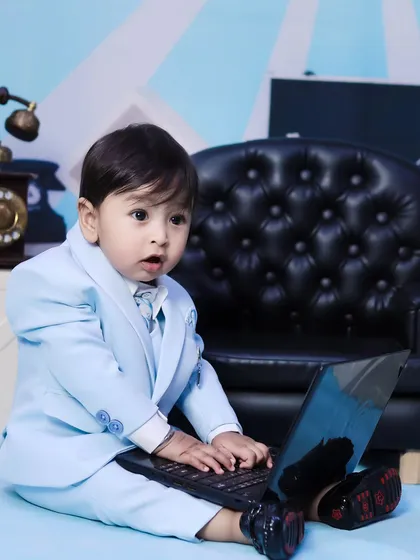 A close-up of our 'Boss Baby' hard at work on his laptop. These humorous, themed shoots are always a hit.