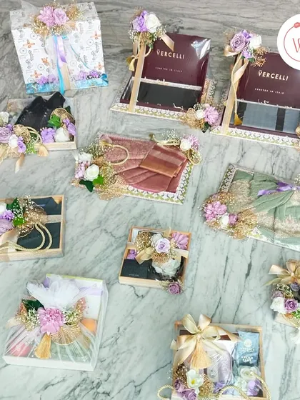 An overview of a complete trousseau packaging project in a purple and white theme, showcasing how we coordinate everything from large boxes to small accessories.