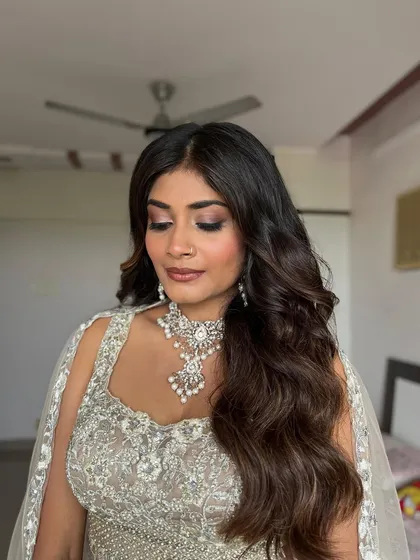 A detailed look at the soft, shimmery eyeshadow I created for this bride. The pink and champagne tones beautifully complement her silver lehenga and diamond jewelry.