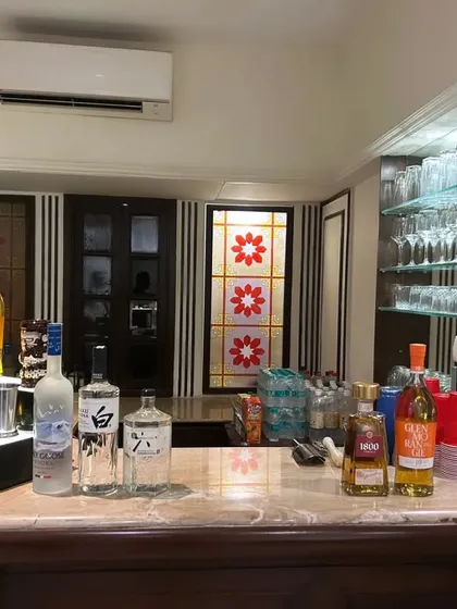 Transforming a home bar for a house party. We bring in our own illuminated displays and a full range of premium spirits to give your personal bar a professional and festive upgrade.
