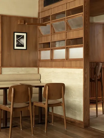 A view of the seating area, showing the custom wooden partition.