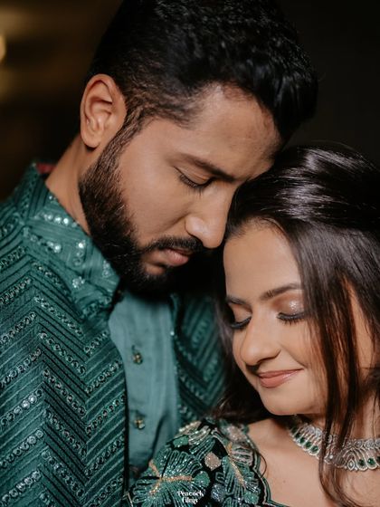 An intimate close-up of the couple, their foreheads touching. This portrait captures the deep connection and quiet love they share.