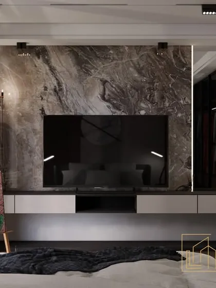 This shot focuses on the entertainment unit, showcasing the dramatic marble slab that serves as a backdrop for the television. Spotlights are used to highlight the texture and pattern of the stone.