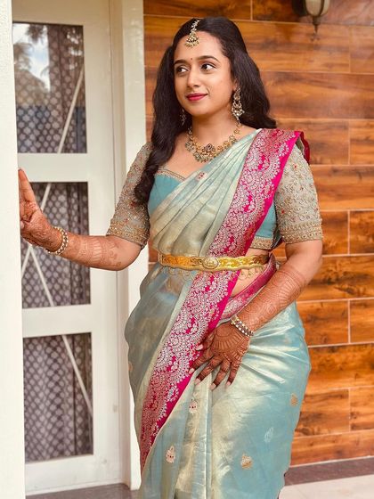 Another shot of the lovely light blue Kanchivaram ensemble, showing the shimmer of the silk and the intricate work on the blouse.