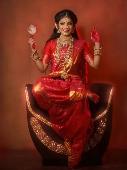 A striking studio portrait from my Navratri Devi concept series, embodying the divine feminine energy of Shakti with traditional red attire and symbolic gestures.