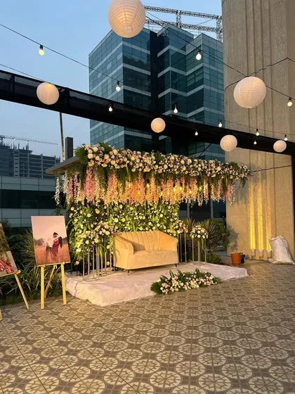 A wider view of the rooftop engagement stage, showing the setup in context with the city skyline. I also included easels to display the couple's photos.