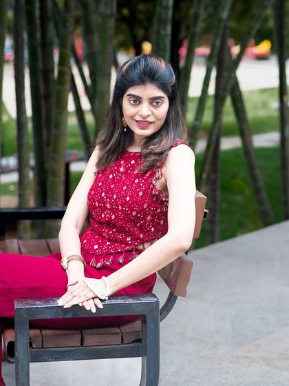 A classic portrait pose in an outdoor setting. This shot is perfect for a professional yet relaxed profile picture.