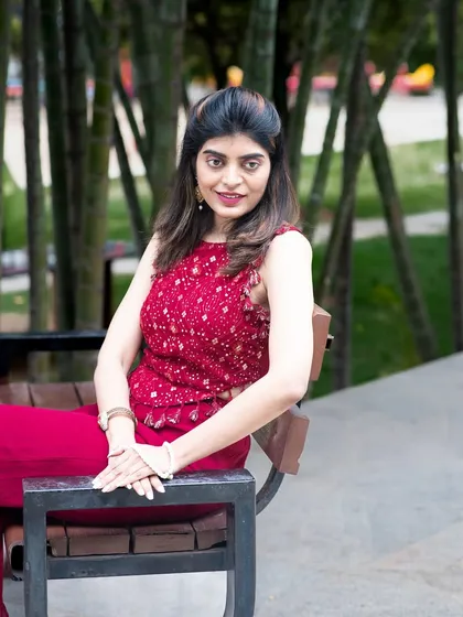 A classic portrait pose in an outdoor setting. This shot is perfect for a professional yet relaxed profile picture.
