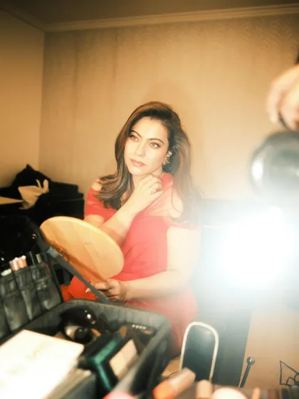 The soft focus and bright flash give this BTS shot a dreamy, vintage film quality.