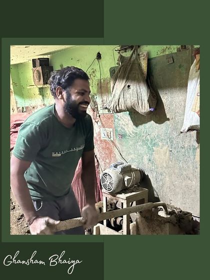 Meet Ghansham Bhaiya, one of the dedicated artisans in our community. This photo captures him at work, mixing clay with a smile, showcasing the hard work and positive spirit that goes into every product we offer.