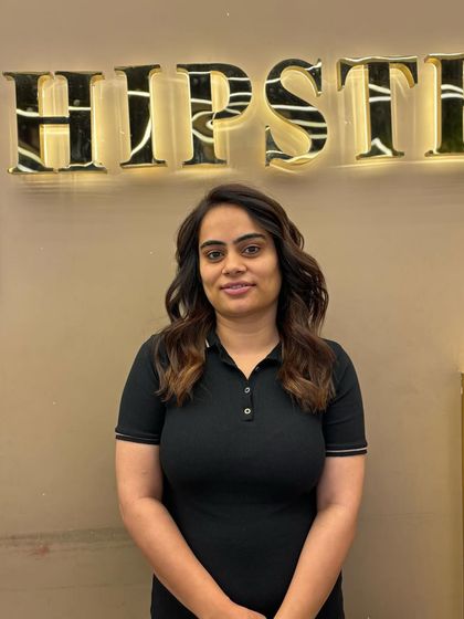 A happy client with her new winter-inspired hair color. The warm tones and soft waves create a cozy and stylish look that is perfect for the season.