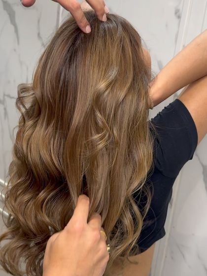 A close-up of the balayage, highlighting the intricate placement of colors and the hair's beautiful texture.