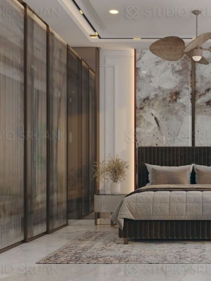 This shot highlights the use of fluted glass panels for the wardrobe, which adds texture and partially conceals the contents for a clean look.