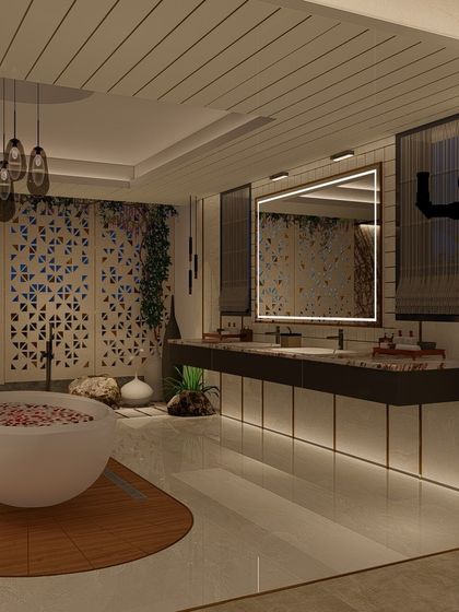 An evening view of the open-plan bathroom, where artificial lighting highlights the different textures and features. The backlit mirror and under-vanity lighting create a warm and inviting glow.