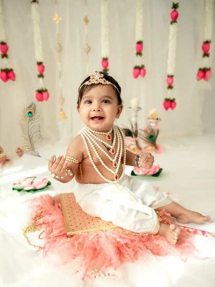 A beautiful little Radha with a peacock feather. The details in my themed sessions, from the outfits to the props, are carefully chosen to create an authentic and magical feel.