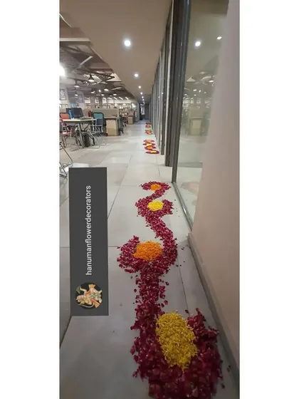 Another example of our floral pathway decorations for a corporate office during Diwali. The flowing design made of fresh flower petals guides people through the workspace in a beautiful way.