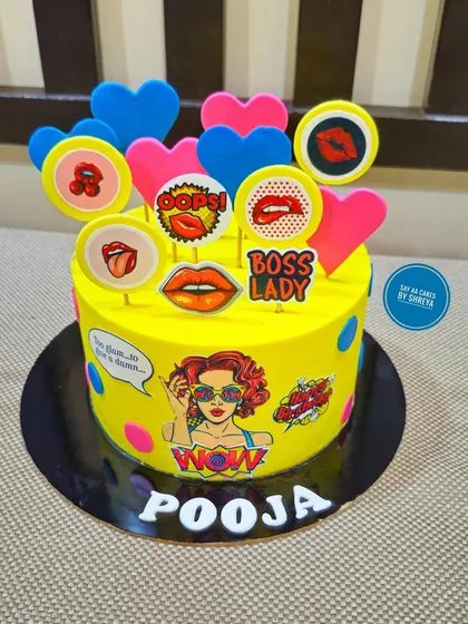 A sassy and vibrant cake for the ultimate boss lady. The bright yellow design is decorated with pop art-style edible prints, creating a bold and empowering statement.