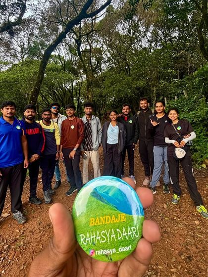 Our group posing on the forest trail during the Bandaje trek, with the trek badge giving a sense of place.