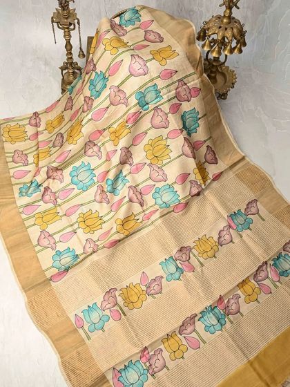 Another shot of the exquisite lotus Kalamkari saree, highlighting the delicate craftsmanship and the use of a pastel color palette.
