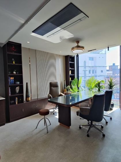 The doctor's consultation room at Life Care Clinic, designed as a desirable and functional workspace. The room features ample natural light, professional yet comfortable furniture, and built-in storage, ensuring a harmonious environment for healthcare providers.