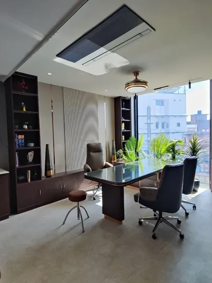 The doctor's consultation room at Life Care Clinic, designed as a desirable and functional workspace. The room features ample natural light, professional yet comfortable furniture, and built-in storage, ensuring a harmonious environment for healthcare providers.