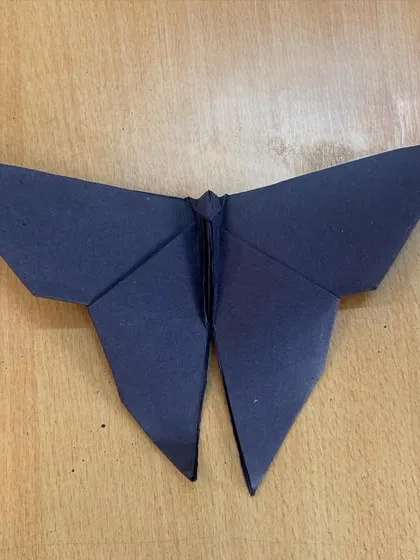 This dark paper butterfly is another creation from our origami workshop. It's a simple yet elegant piece that demonstrates the beautiful forms that can be made just by folding paper.