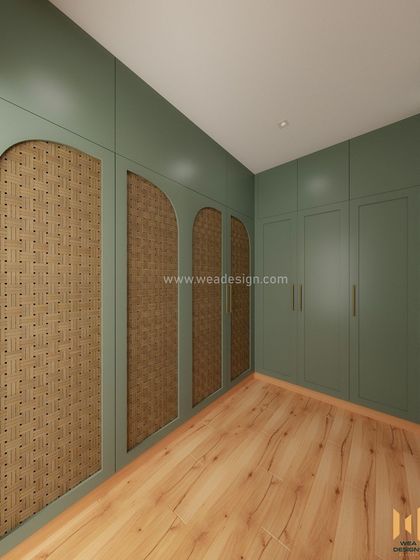 The L-shaped swing wardrobe in the Scandinavian room, featuring sage green PU paint and arched rattan panels for a touch of softness and texture.