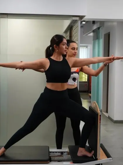 Personal attention to form is everything. Here, I am making a small adjustment to ensure perfect alignment. This hands-on approach guarantees that you are engaging the right muscles, moving safely, and achieving quality in every repetition.