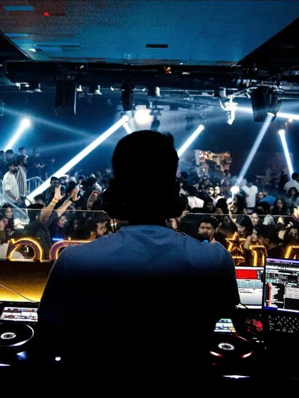 This is my view from the console at a packed club. My job is to command the room, reading the crowd and taking them on a journey through different sounds and visuals, making sure the energy never drops.