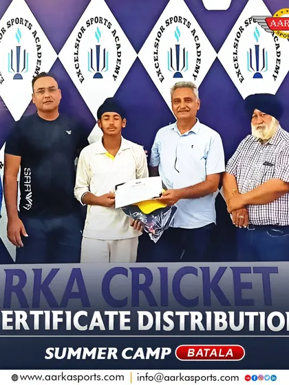 A student receives his certificate and gear at the end of the Batala summer camp. We equip our players with both skills and encouragement.