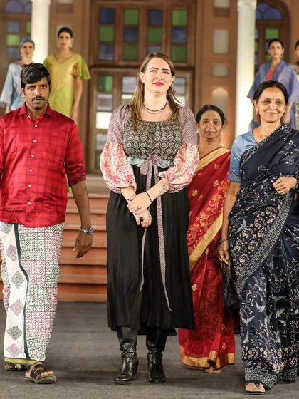 A collection from the 'Walking Hand in Hand' fashion show, where artisans share the spotlight with designers. This look, created with Liz Hartman, showcases pattern dye and discharge prints on handloom fabrics.