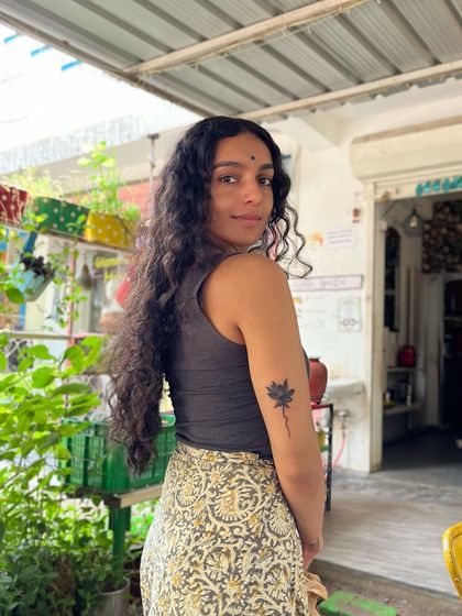 A portrait taken during a moment of reflection. It accompanies more wisdom from Sadguru, emphasizing that our happiness depends on our ability to surrender and accept what life brings.