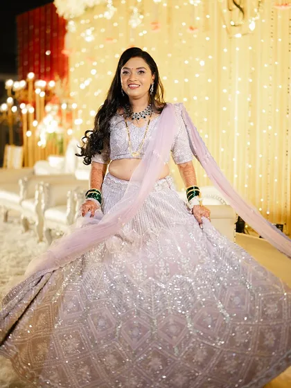 The bride twirling in her beautiful lavender lehenga, looking absolutely ethereal.