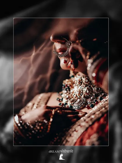 A close-up shot focusing on the intricate details of Khushbu's bridal nath and necklace, capturing the essence of traditional Indian bridal jewelry.