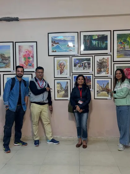 Posing with friends in front of our displayed works at the IWS festival. The art community is so supportive and it was a joy to share this experience.