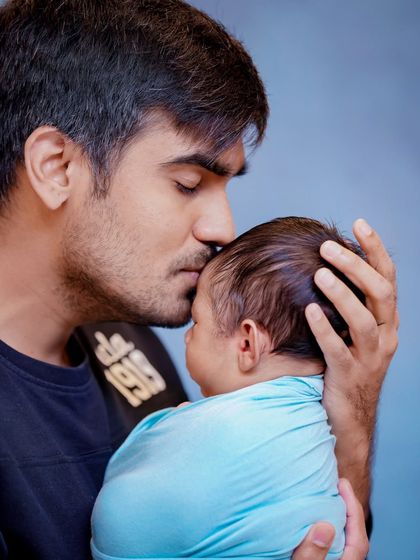 The gentlest of kisses. A father's love for his newborn is a powerful and tender thing to witness, and I am honored to capture it.