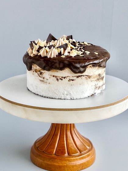 If you're not a fan of too much cream, my semi-naked cakes are the perfect choice. This style, shown here on a classic chocolate cake, gives you just a light scraping of frosting, keeping it moist while focusing on the rich flavor of the cake itself.
