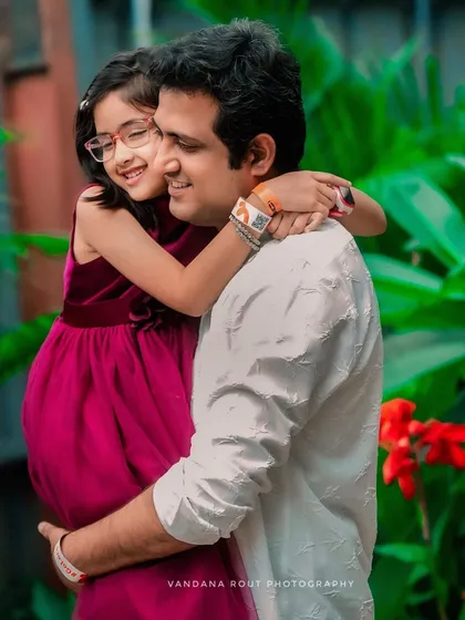 Another angle of a father and daughter's embrace, showing the deep affection and comfort in their relationship. Capturing these candid hugs is a specialty of mine.