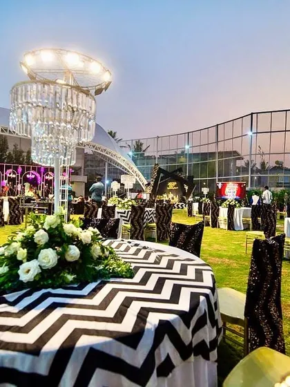 The elegant guest seating at the 60th birthday party, with custom table linens and chandelier centerpieces.