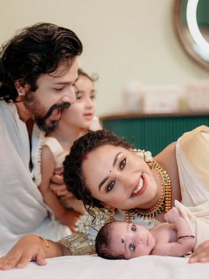 A precious family moment with Pearle Maaney, Srinish, and their children. Pearle looks effortlessly elegant in the set mundu I draped for her.