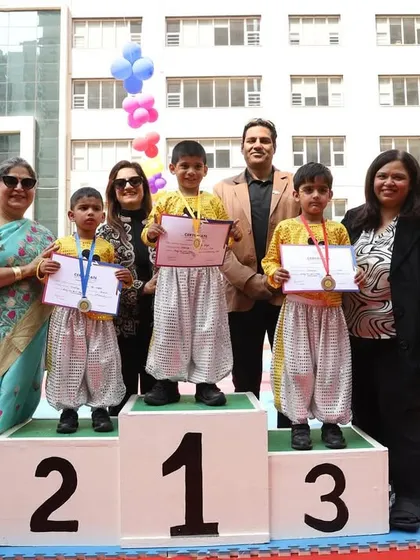 We celebrate every achievement, big and small. Here, our young champions stand proudly on the winners' podium with their parents and our school leaders during our Annual Sports Day, 'Khelchakra'.