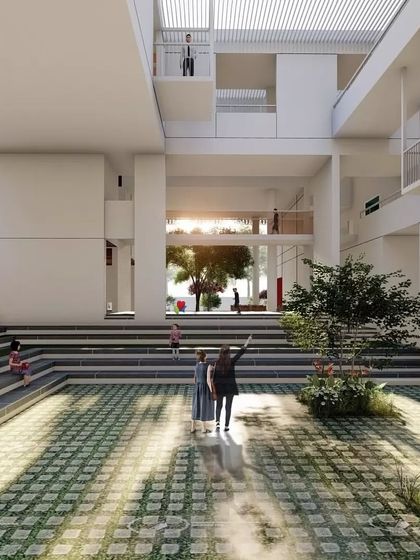 A 3D render of the Brilliant National School, focusing on the central amphitheater. This space is designed as the heart of the school, a place for gathering, performance, and community.