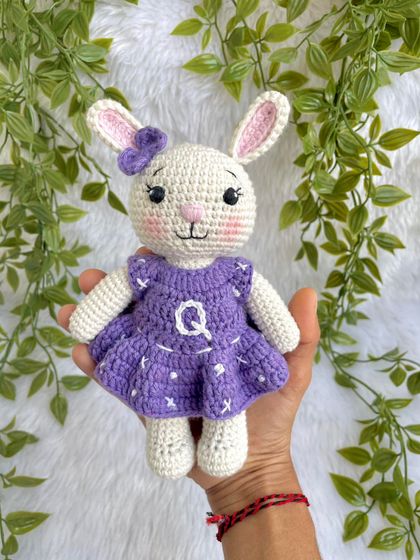 A lovely bunny in a purple dress with a custom initial "Q" on it. I made a similar one for my own daughter's birthday, and she absolutely adores it!