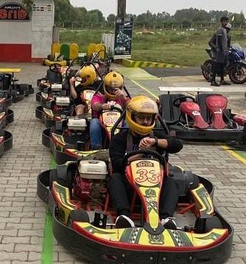 The holiday season is the perfect time for some go-karting. Here's a group getting ready to start their engines and enjoy the festive break.