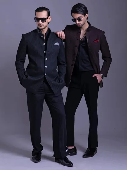A powerful stance in two different Bandhgala styles. This image showcases how a classic silhouette can be adapted to different personalities while maintaining a regal look.