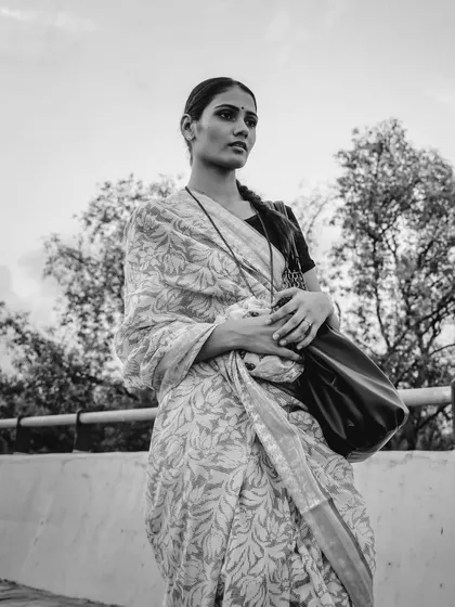 A thoughtful moment captured in monochrome. This image feels like a still from a classic film, full of emotion and story.